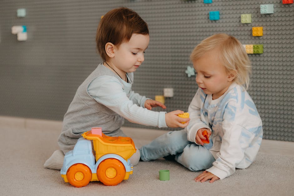 toddlers playing together blocks colorful classroom friendship