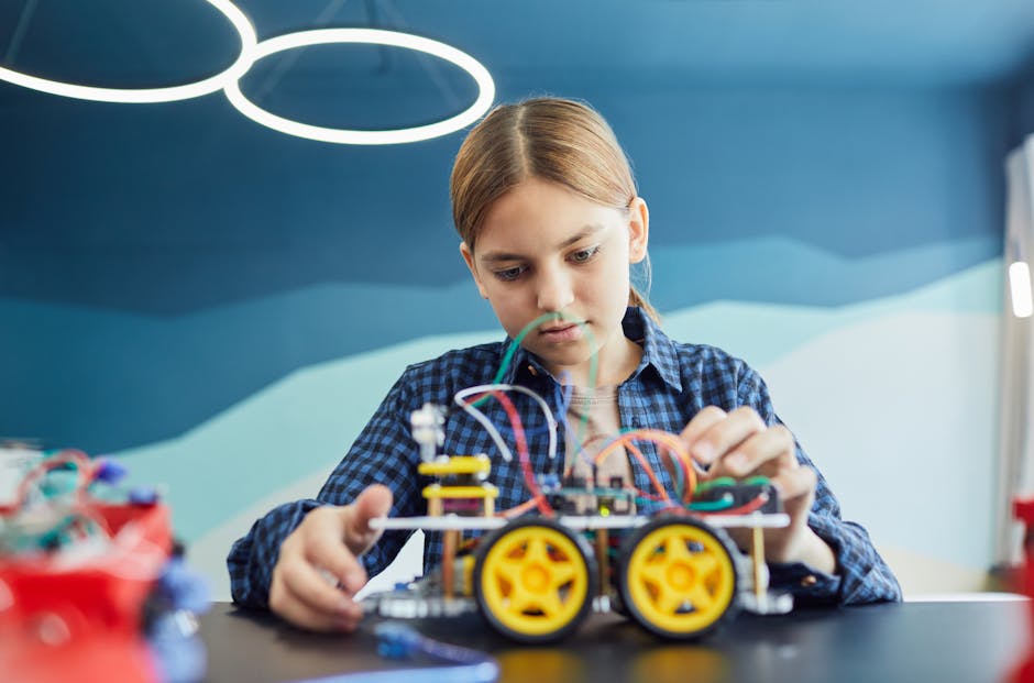 female students STEM classroom coding robotics