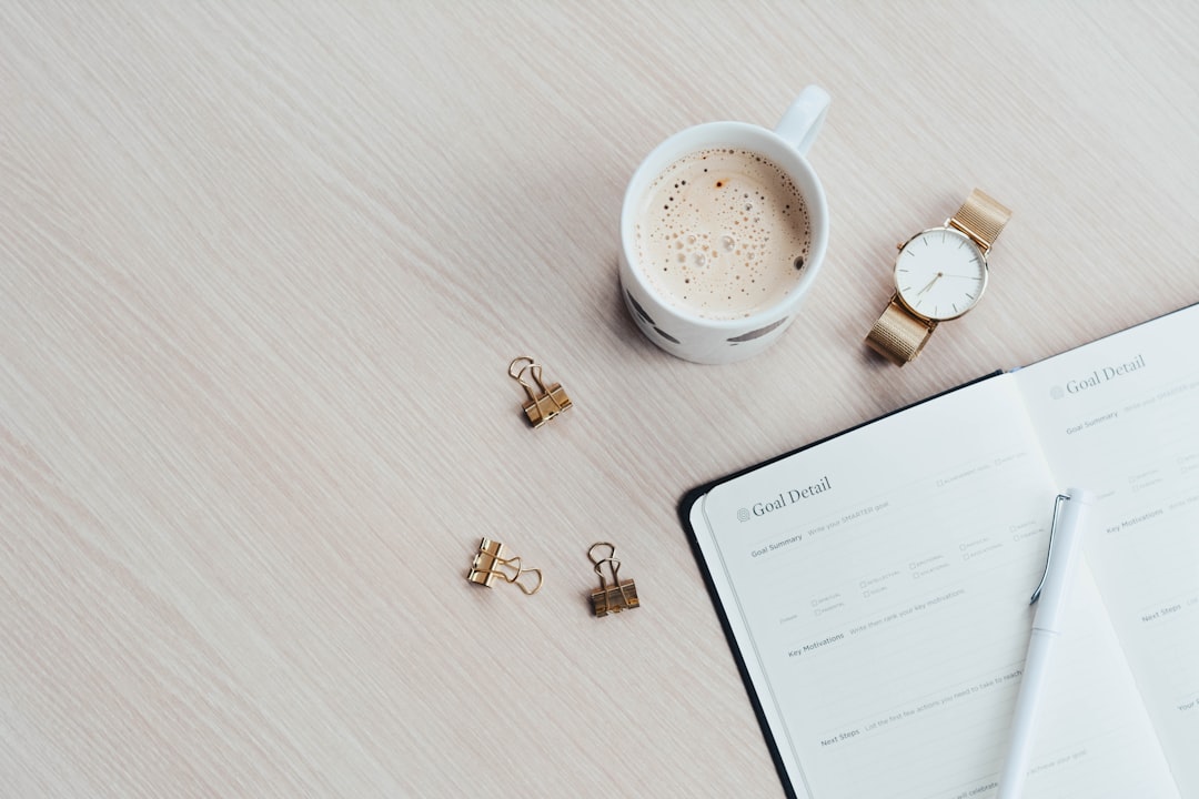 personal budget planning, financial notebook and coffee