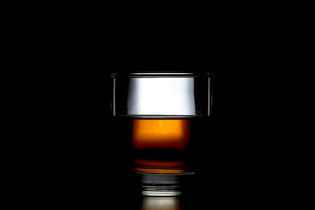 single malt whisky bottles collection, amber whisky glass light